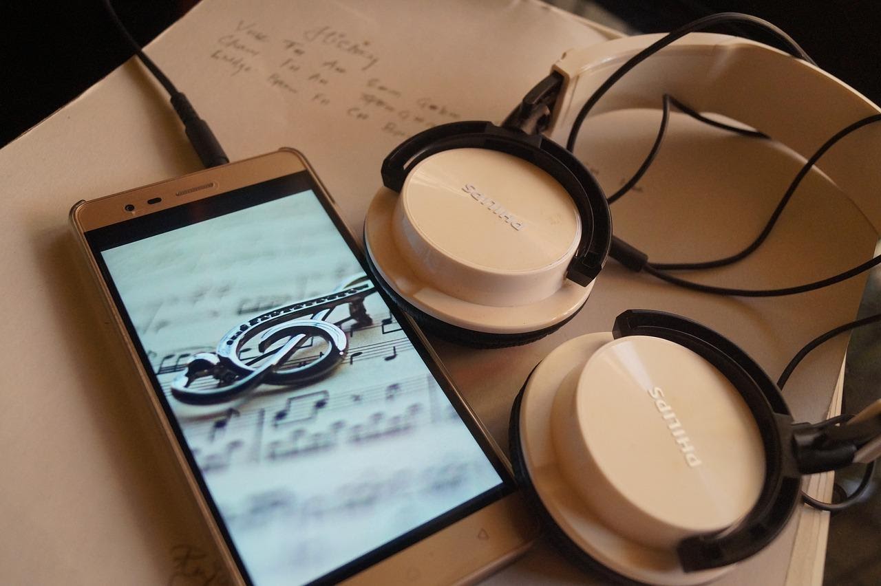 Headphones a notebook and a music creation app